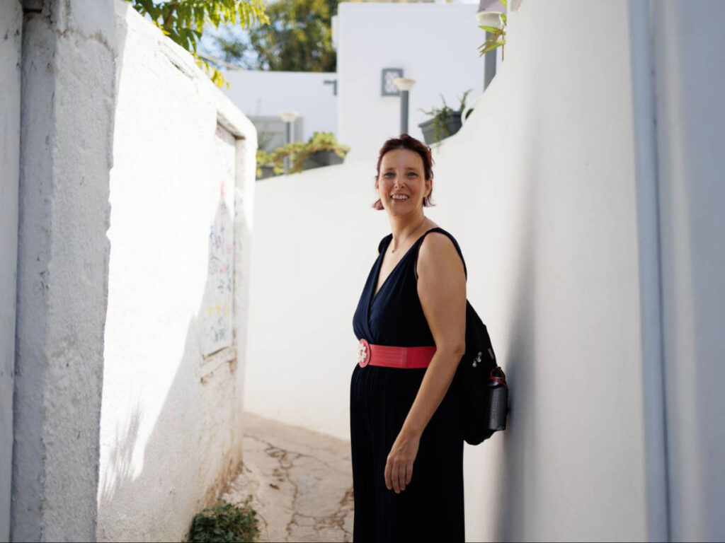 The author Rebecca Hall, walking along the Anafiotika