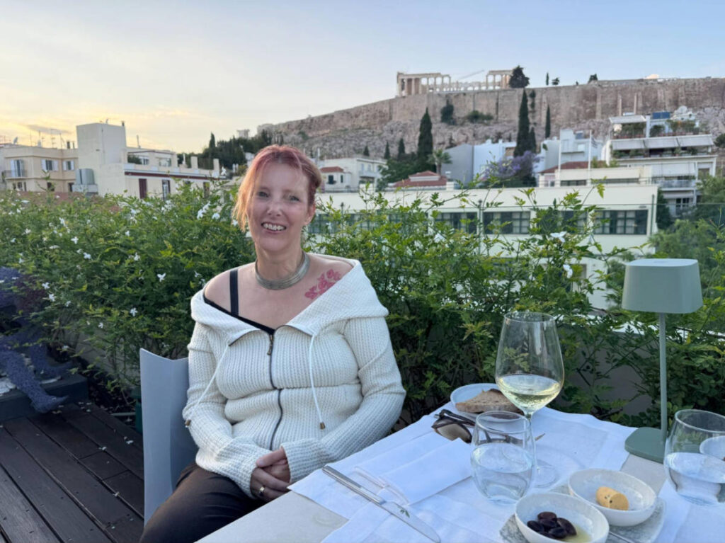 The author Rebecca Hall, sitting outside Herodian Hotel