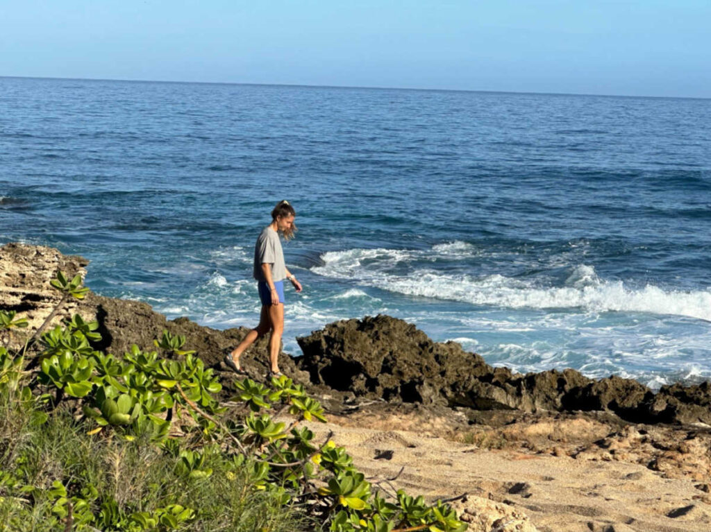 The author Rebecca Parsons walking at Kaena Point