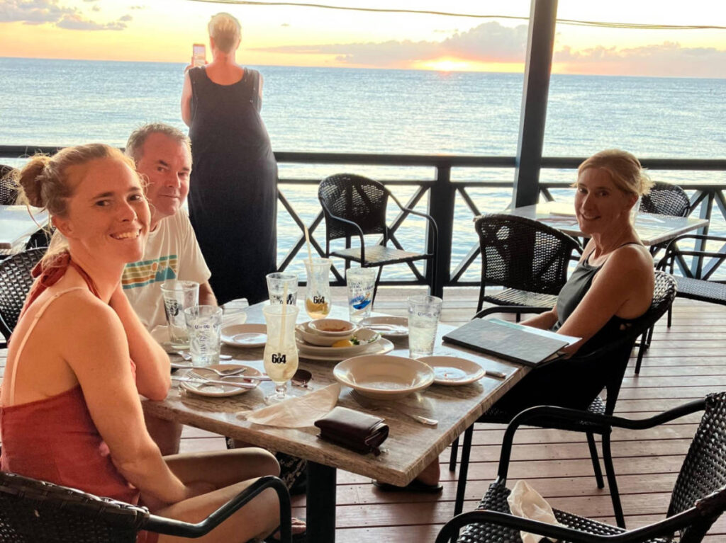 The author Rebecca Parsons with her family dining at the beachfront  of The Beach House
