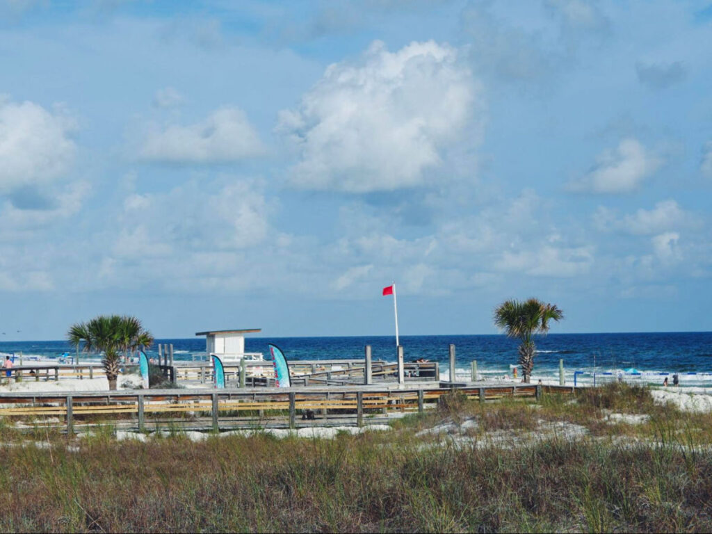 View of the Red safety flag flying over the beach