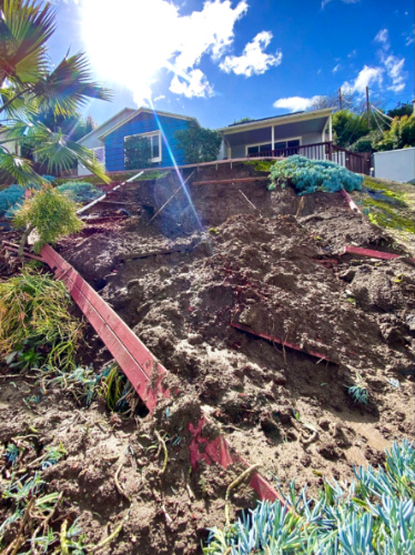 View of the remains of the freshly planted landscape after a mudslide