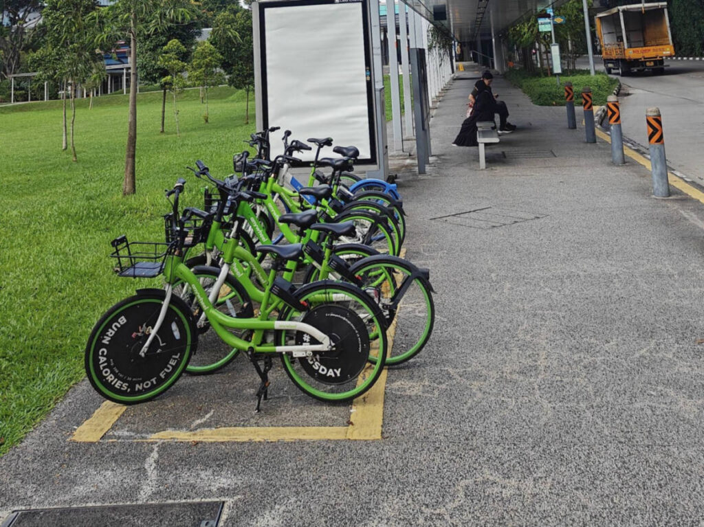 View of the vibrant green rental bicycles at a park in Singapore