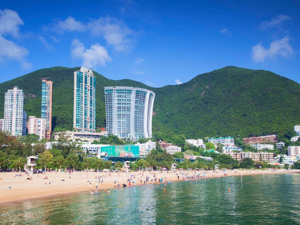 View of the buildings and people enjoying the beach at Repulse Bay