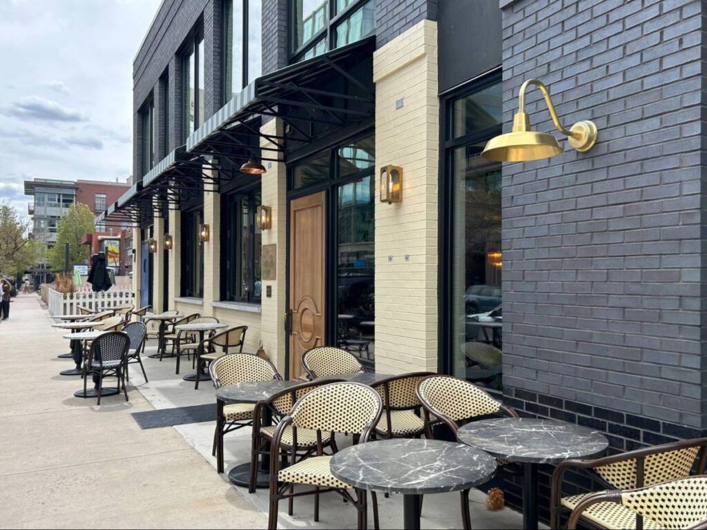 The outdoor seats of the restaurant along the Cherry Creek