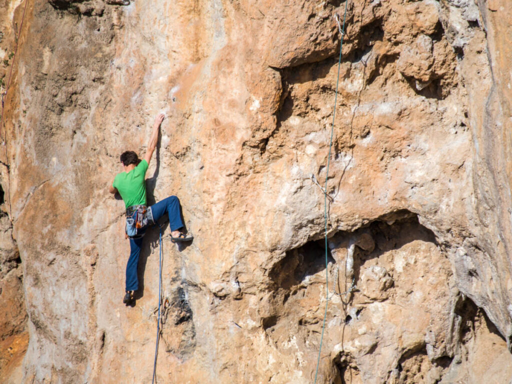 A rock climber on a steep route