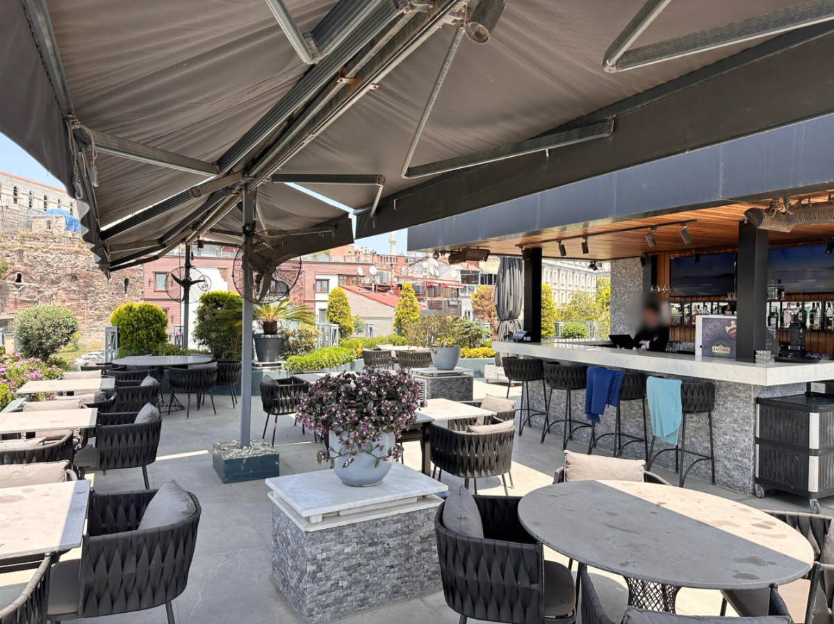 View of the empty seats at the rooftop cafe at Hotel Amira