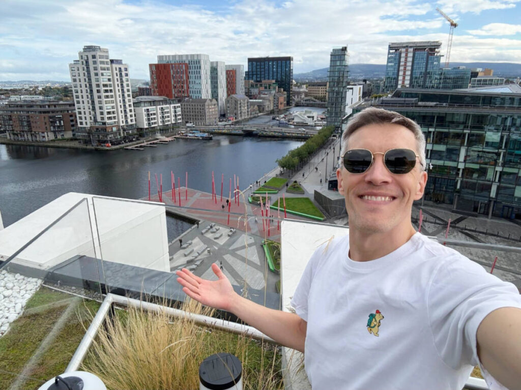 Nate Hake, smiling for a photo at the rooftop of Anantara-The Marker