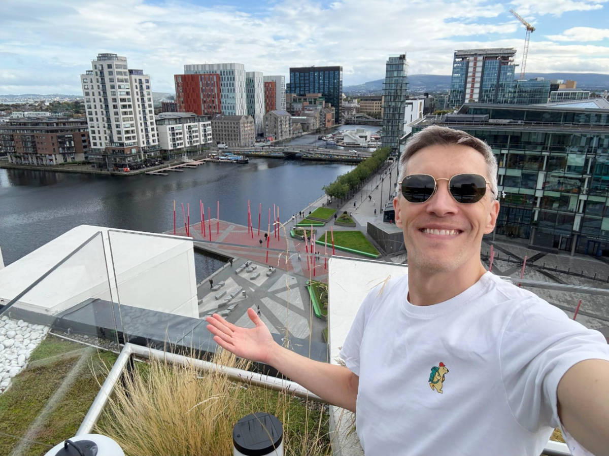Nate Hake, smiling for a photo at the rooftop of Anantara-The Marker
