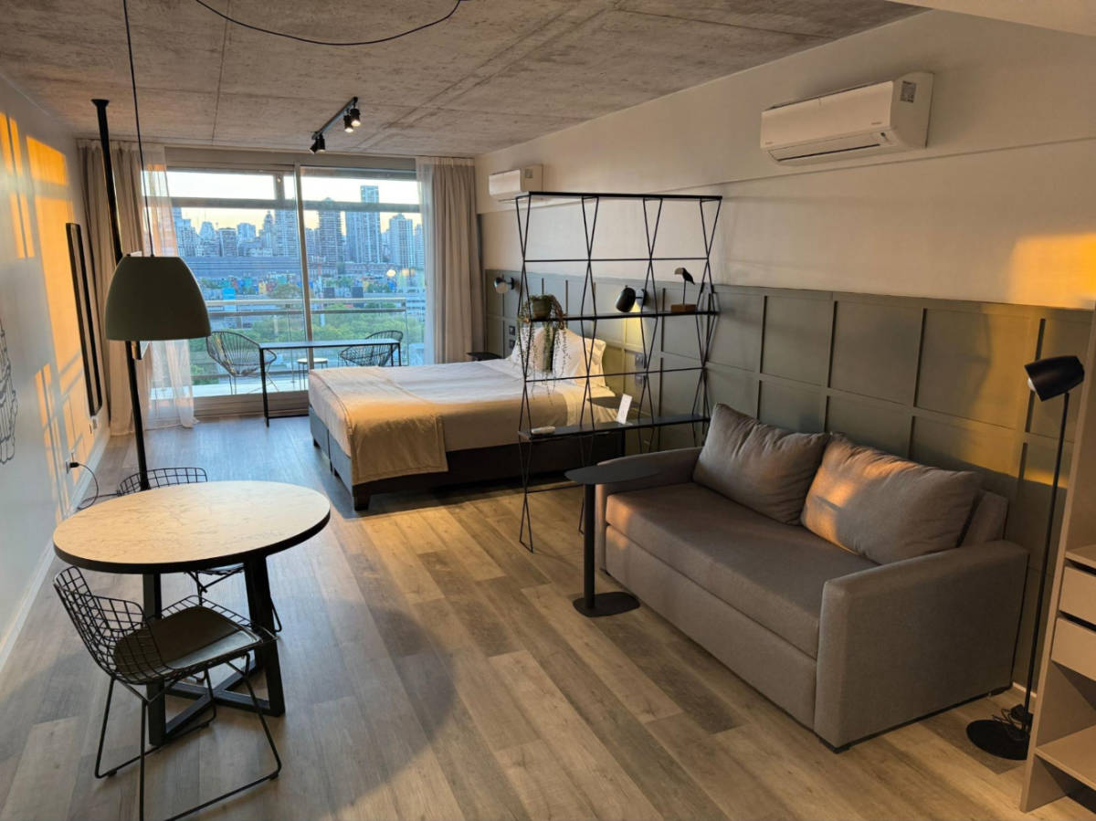 Inside the huge room with scenic view from the big window in Almarena Puerto Retiro Affiliated by Melia