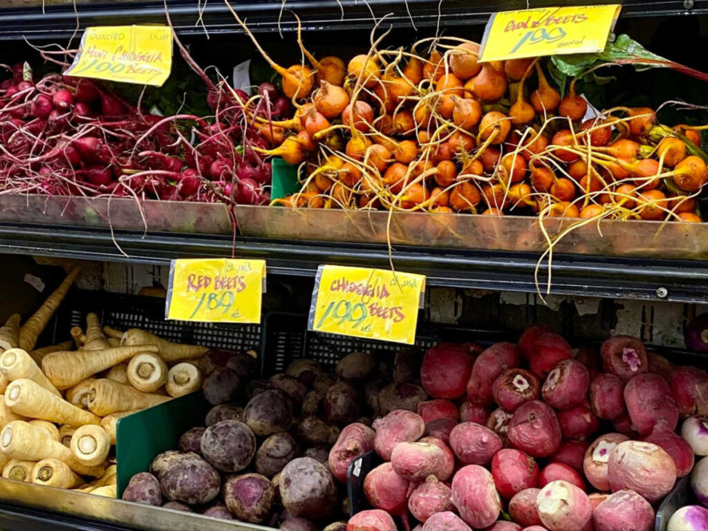 View of the variety of colors of the root vegetables displayed at Berkeley Bowl