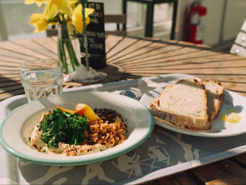 Plates of Hummus with parsnip and kale at Rosendals Trädgård