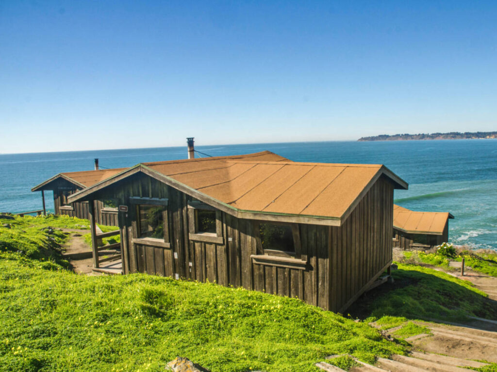 Panoramic view of the rustic cabins overlooking the ocean