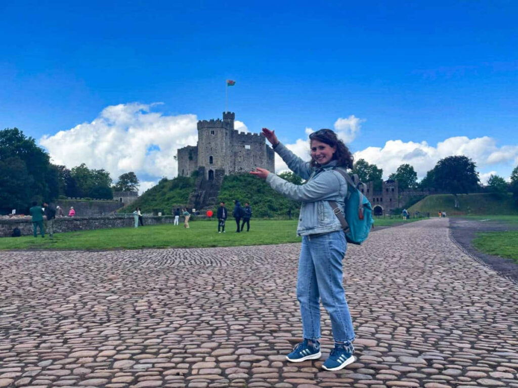 The author Ruthie Walters, "holding" the Norman Keep, Cardiff Castle