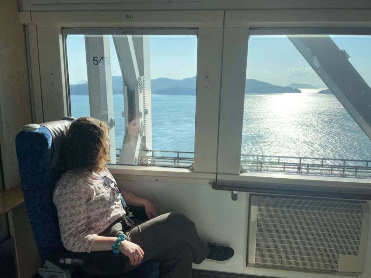 The author Ruthie Walters enjoying the coastal view from the train ride