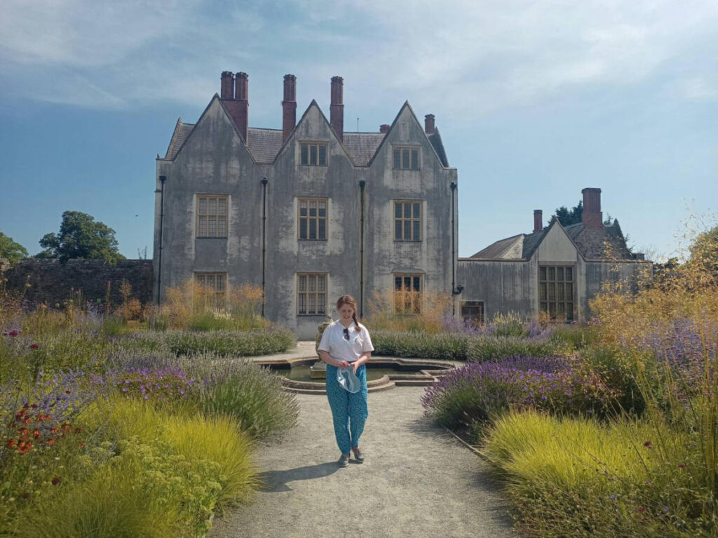 The author Ruthie Walters, walking outside the St Fagans Castle
