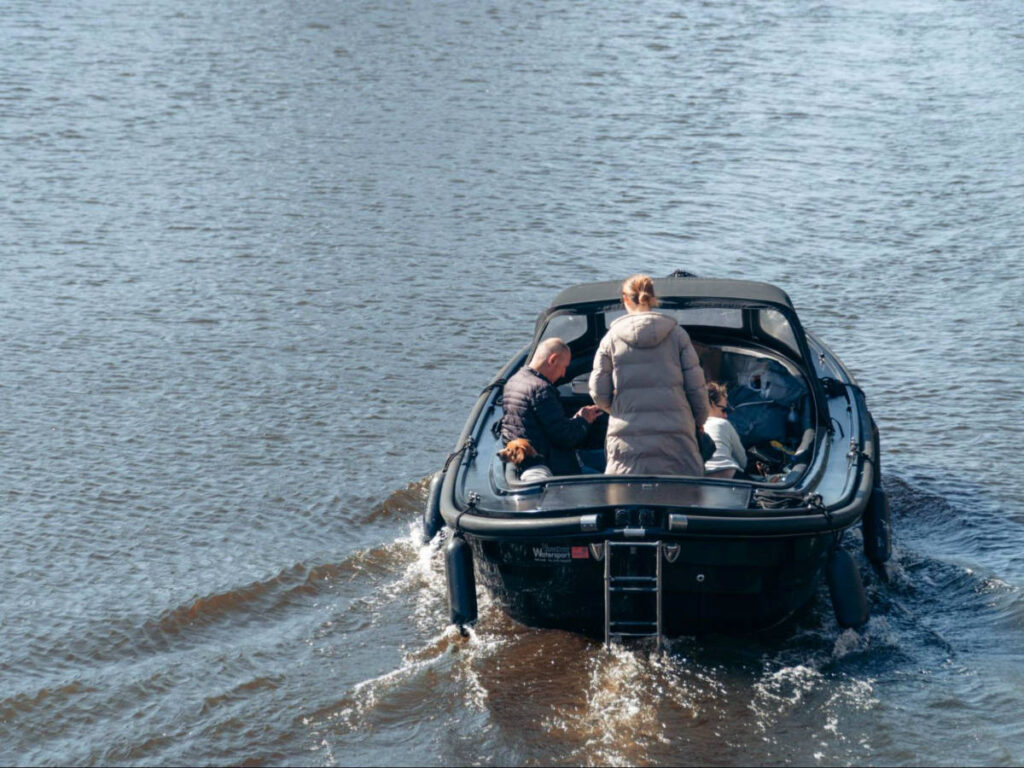 A group riding a boat in Amsterdam