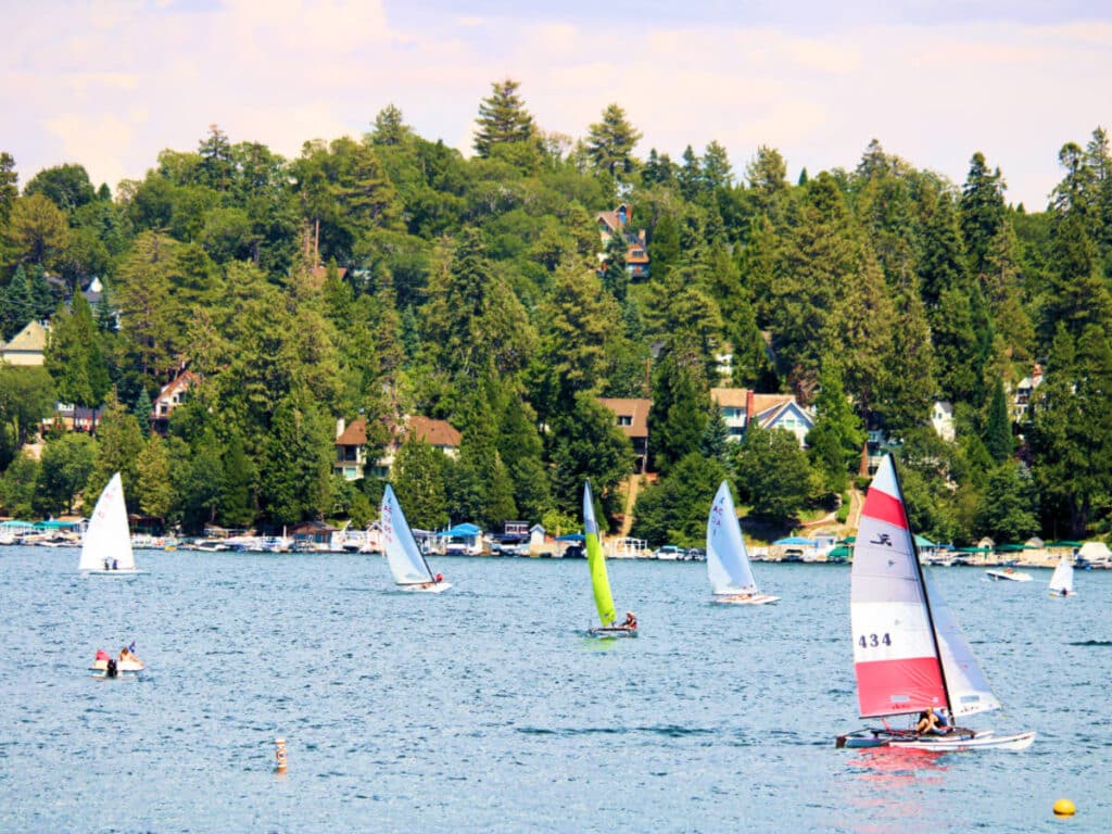 View of the yachts and sailboats on the Lake Arrowhead with the lush mountain in the background