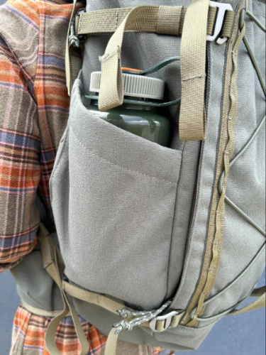 A water bottle on the side pocket of the Salkan Carry-On Backpack
