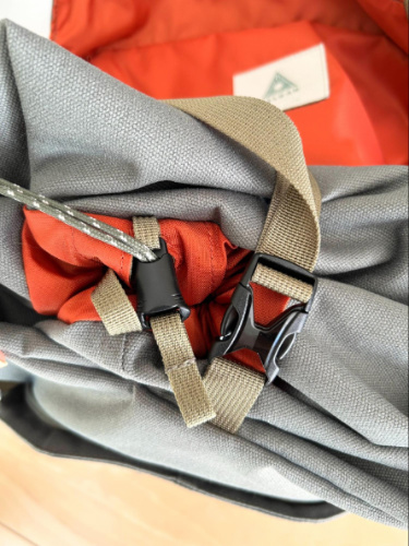 Close up view of the top opening with drawstring cinch and buckle of the Salkan Carry-On Backpack