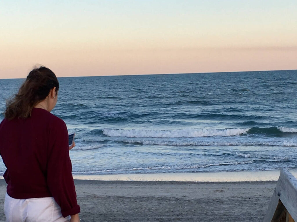 The author's daughter browsing on her phone at the Myrtle Beach