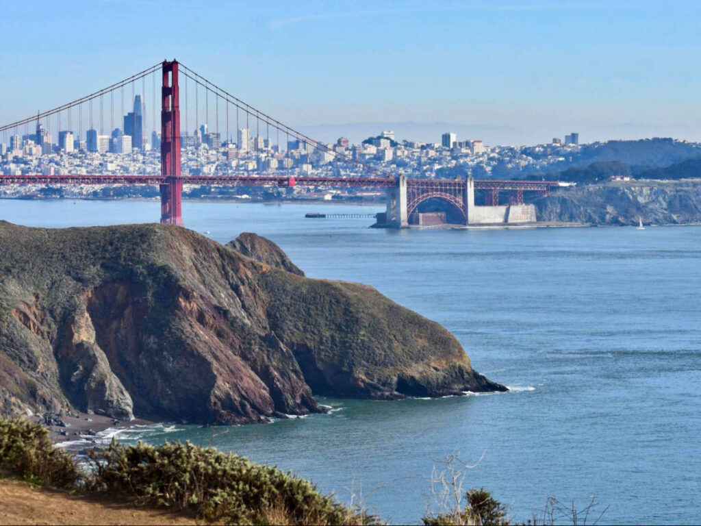Panoramic view of the San Francisco skyline and the Golden Gate Bridge from a distance