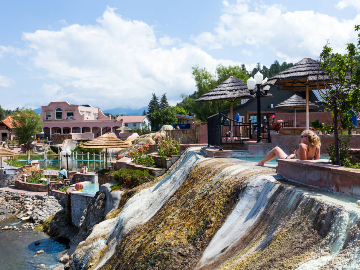 View of the tourists relaxing at the San Juan river hot springs