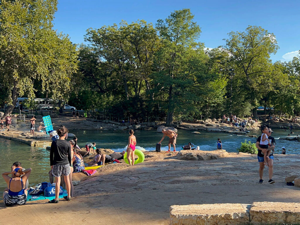 People swimming and tube floating at San Marcos River