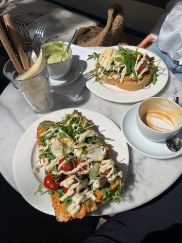 Variety of sandwiches and cups of coffee