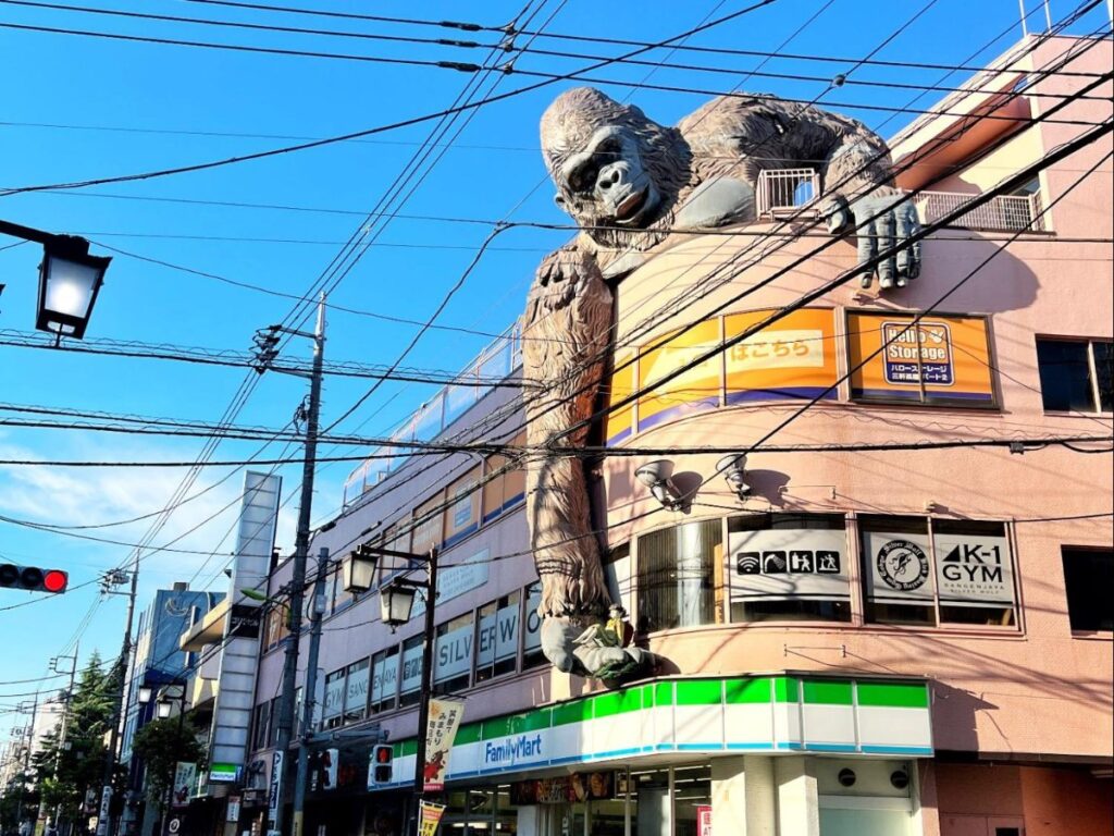 King Kong hovering above a Family Mart