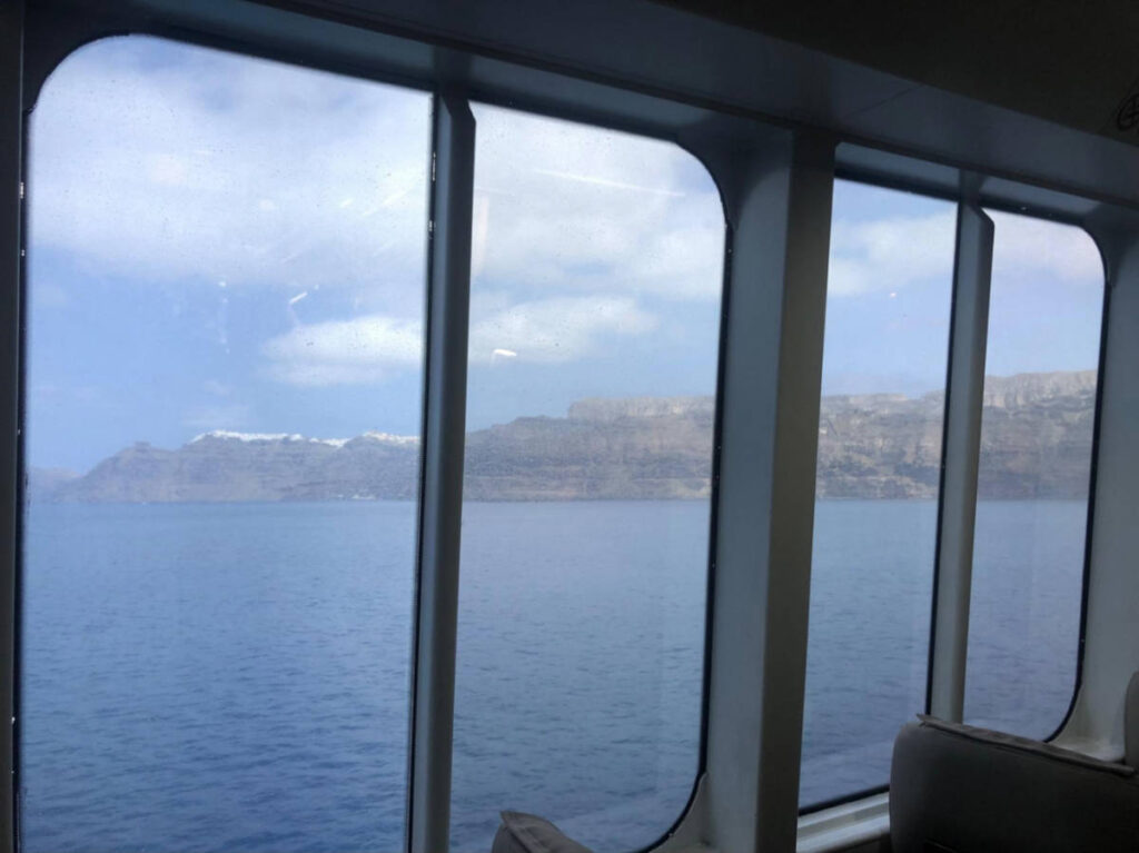 View of Santorini from the windows of the ferry