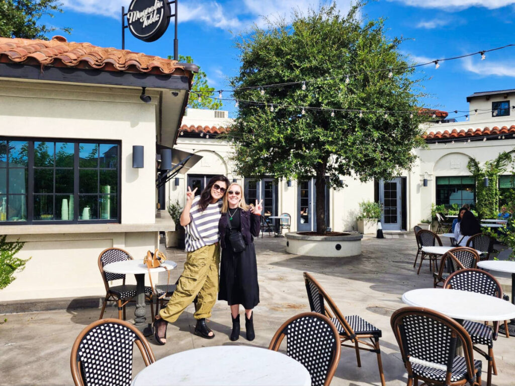 The author Sarah Heath and her friend, posing for a photo at the Magnolia Table in Waco