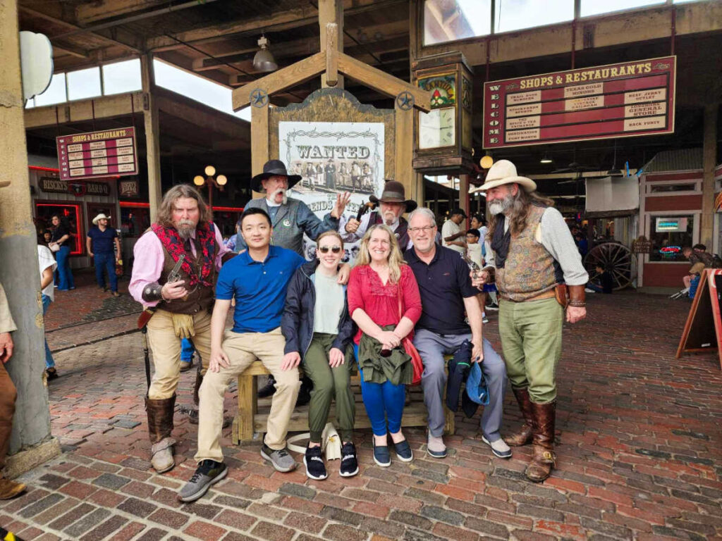 The author Sarah Heath and her friends taking a group photo at Stockyards