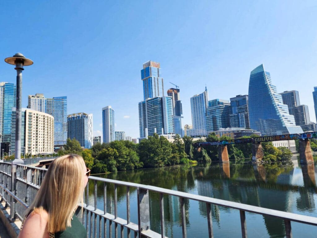 The author Sarah Heath, enjoying the cityscape while walking along the Pfluger Pedestrian Bridge