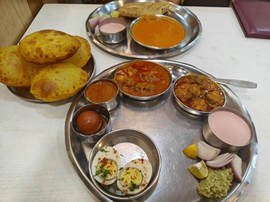 A tray with chicken and fish thalis at Goregaon restaurant