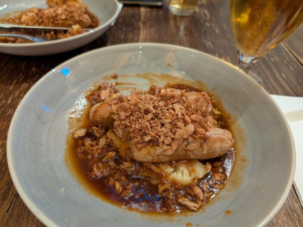 A plate of sausages and mashed potato