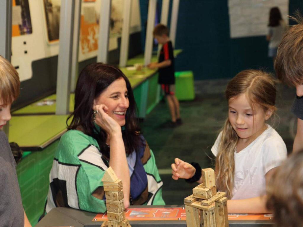 The author Lisa Ikin and the children having fun in Scitech
