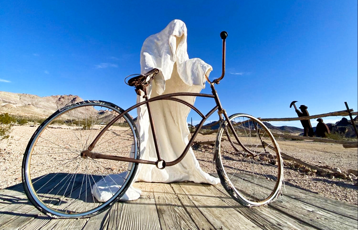 View of the unique sculpture holding a bicycle at Rhyolite Ghost Town