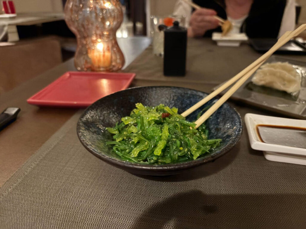A small bowl with seaweed salad at Mirai
