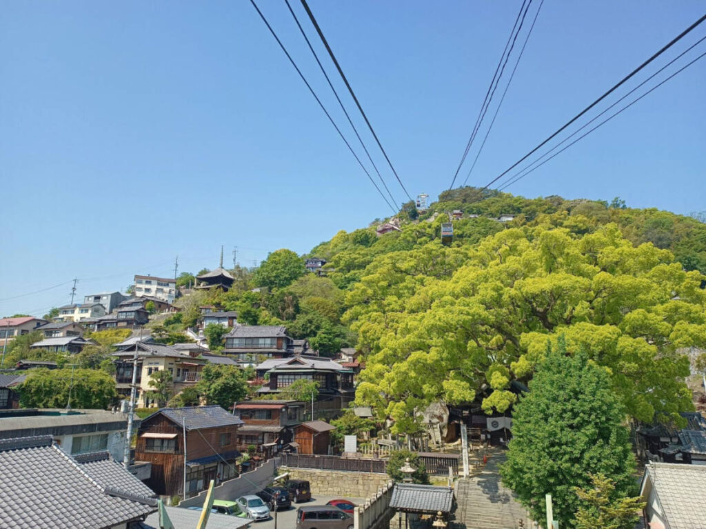 View of the Senkoji Mountain Ropeway surrounded by lush greenery