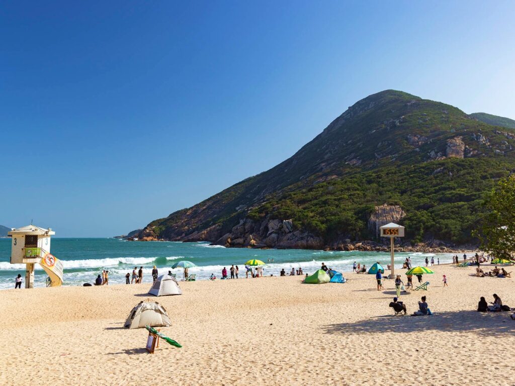 People swimming and relaxing at Shek O beach