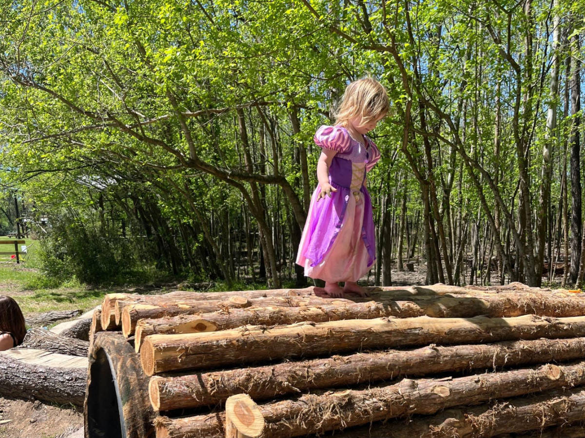 The author's daughter playing in Shelby Bottoms Nature Play