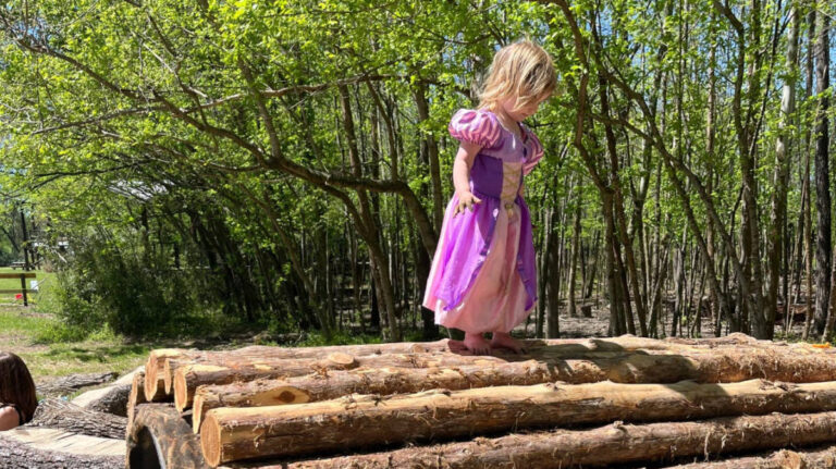 The author's daughter playing in Shelby Bottoms Nature Play