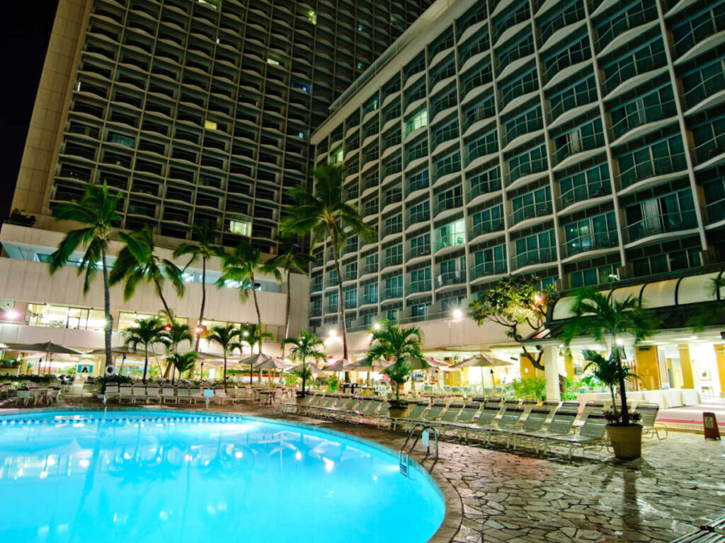 View of the pool area of Sheraton Princess Kaiulani at night