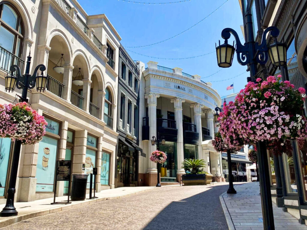 View of the shops along the empty street at Rodeo Drive