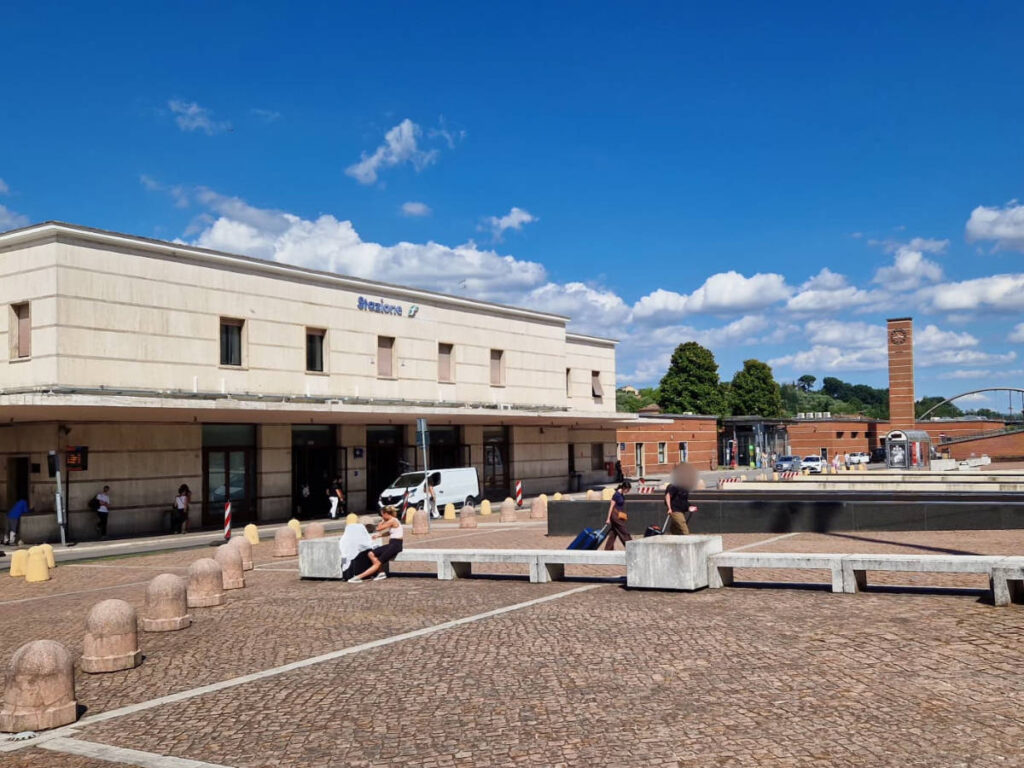 People walking outside Siena Train Station