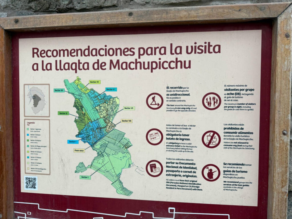 A signage with a map at the entrance to Machu Picchu