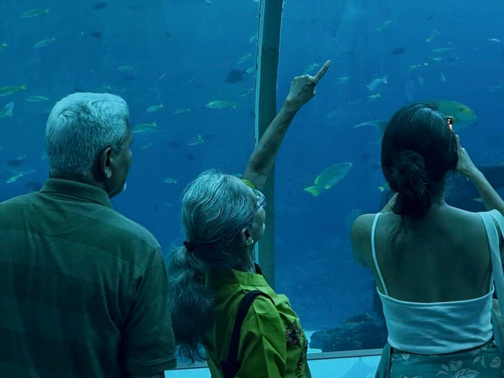 The author, Advaita with her parents at the Singapore Oceanarium