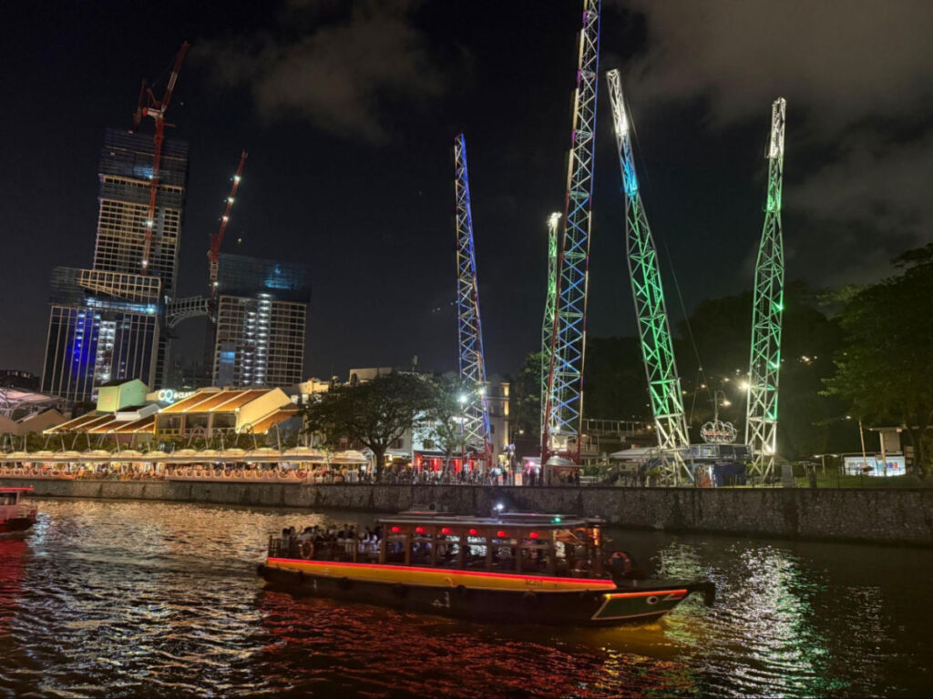 View of tourist bumboat cruising the Singapore River