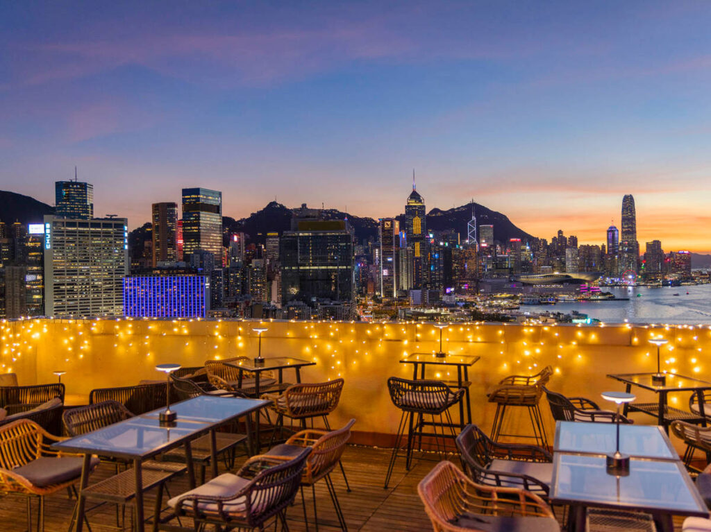Overlooking skyline views illuminated from the Sip Sip Rooftop Bar at night